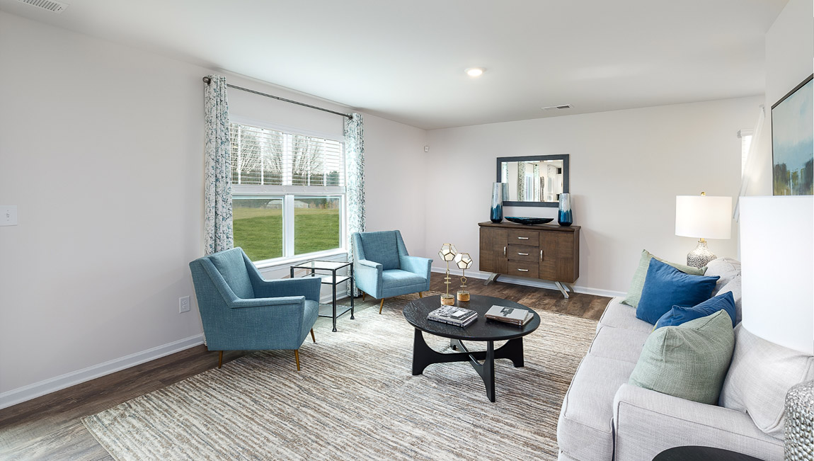 Dining area by kitchen, beside sliding glass doors outside