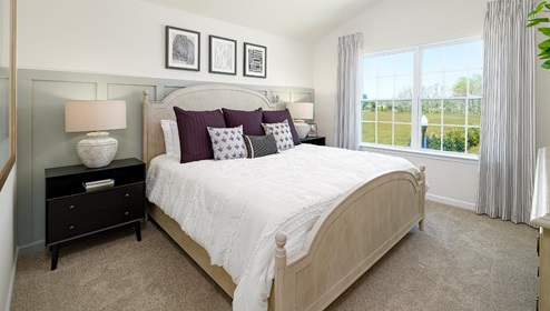 Fergus Crossing Townhomes Newton Model primary bedroom with carpet, and large window