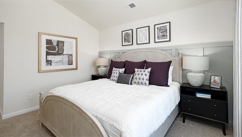 Fergus Crossing Townhomes Newton Model primary bedroom with carpet, and large window