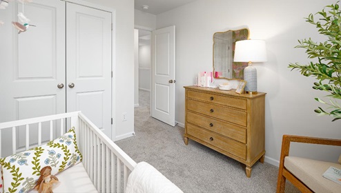Fergus Crossing Townhomes Newton Model carpeted bedroom with small window
