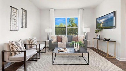 Fergus Crossing Townhomes Model Living room space with large window