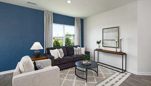 Fergus Crossing Townhomes Newton Model modern open family room with wood floor and large window