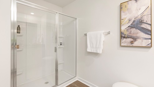 Primary bathroom with double sink vanity and large shower