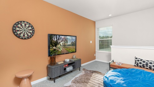 Carpeted bedroom with small windows