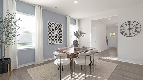 Breakfast area beside kitchen with large windows