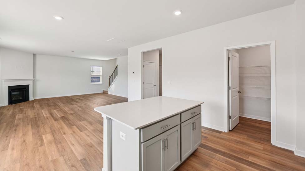 Kitchen and island with stainless steel appliances