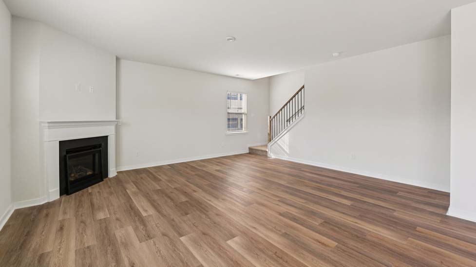 Living room area with fireplace and windows