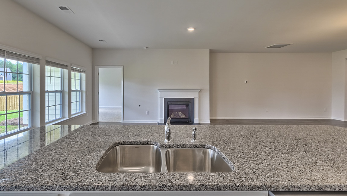 Kitchen and island with white cabinets