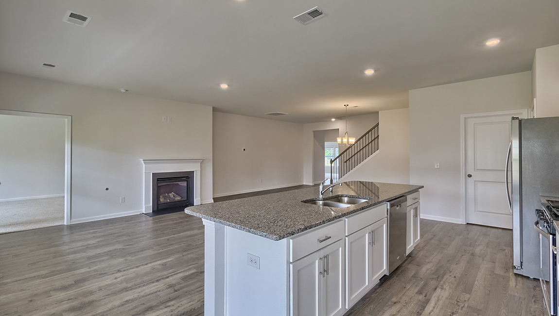 Kitchen and island with white cabinets