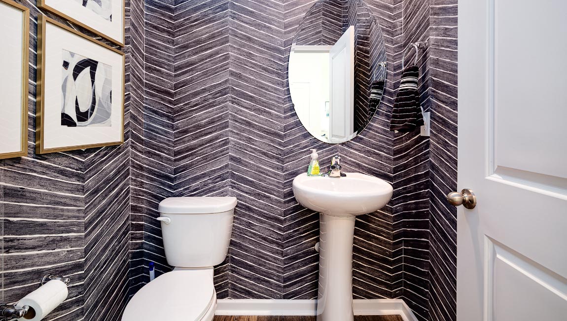 Powder bathroom with toilet and small sink