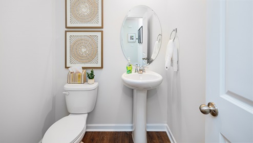 Powder bathroom with small sink and toilet