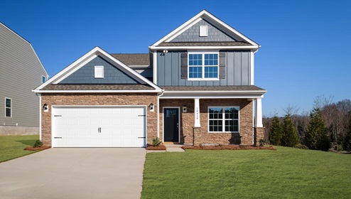 Winston C front exterior photo with siding and two car garage