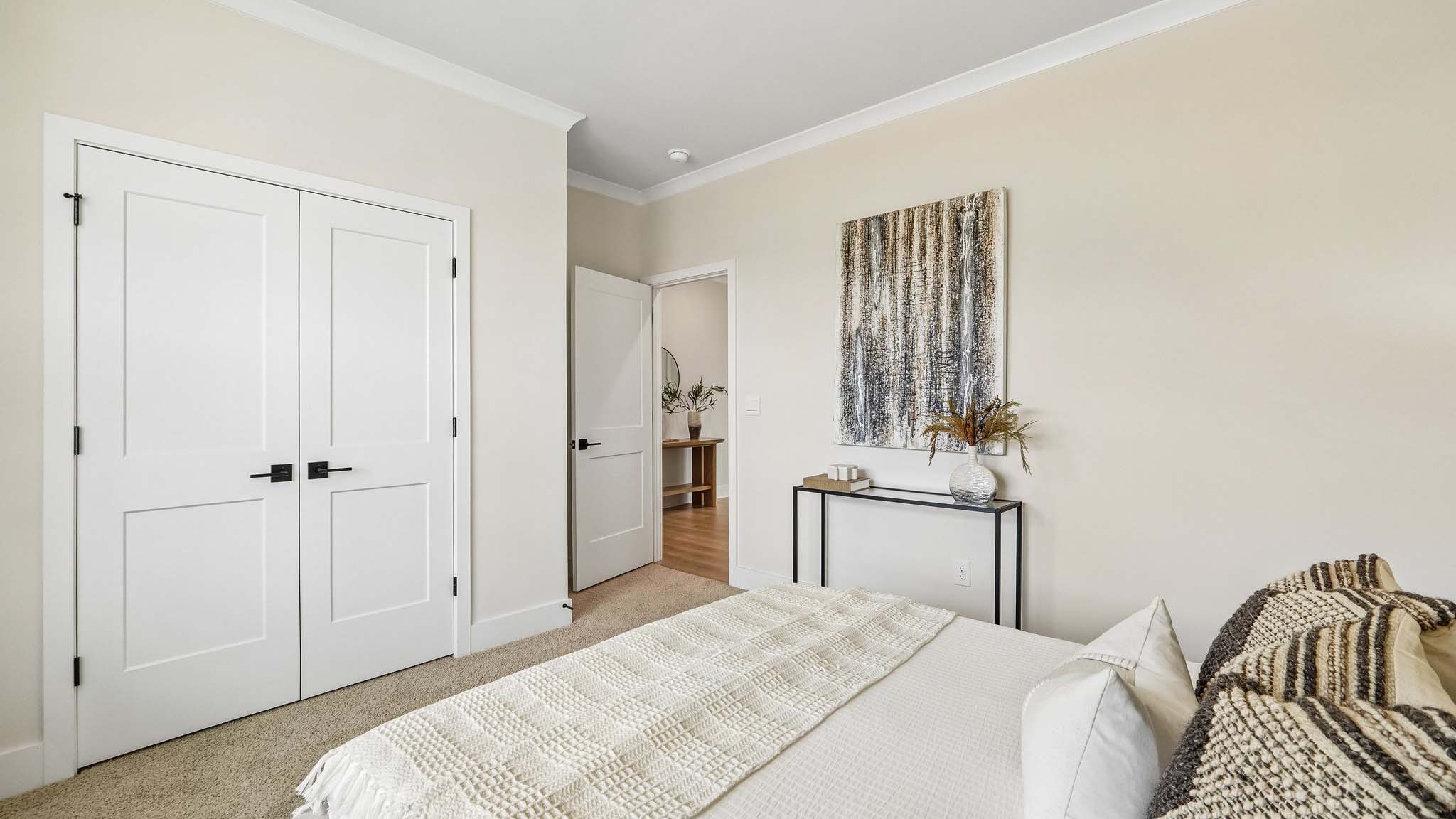 Carpeted bedroom with windows