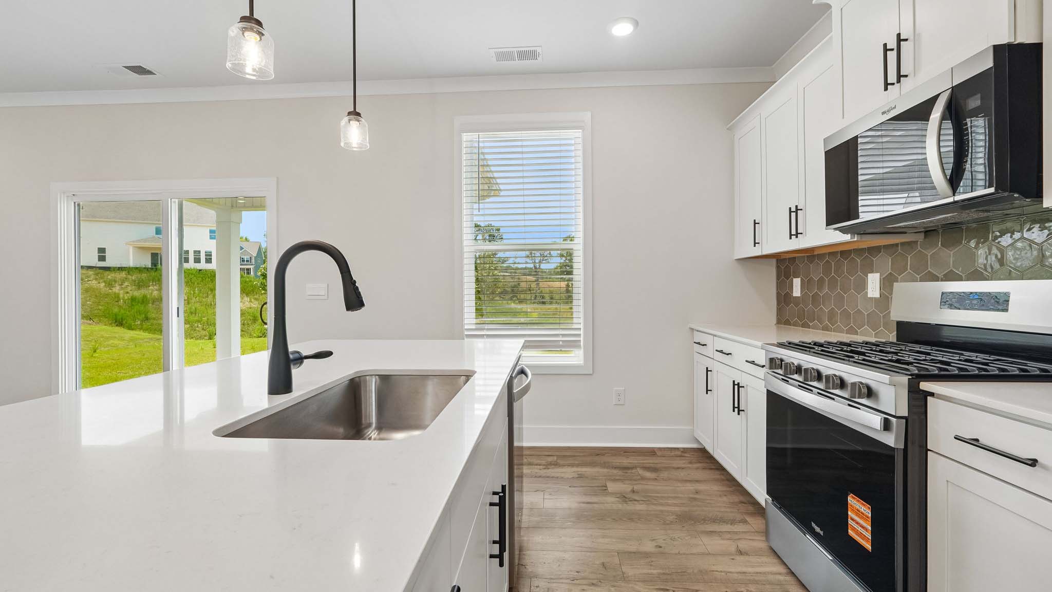 Kitchen and island with windows