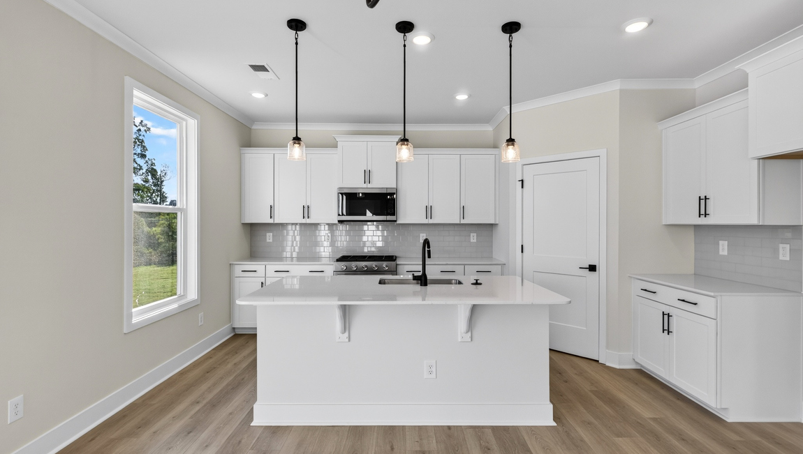 Kitchen and island with windows