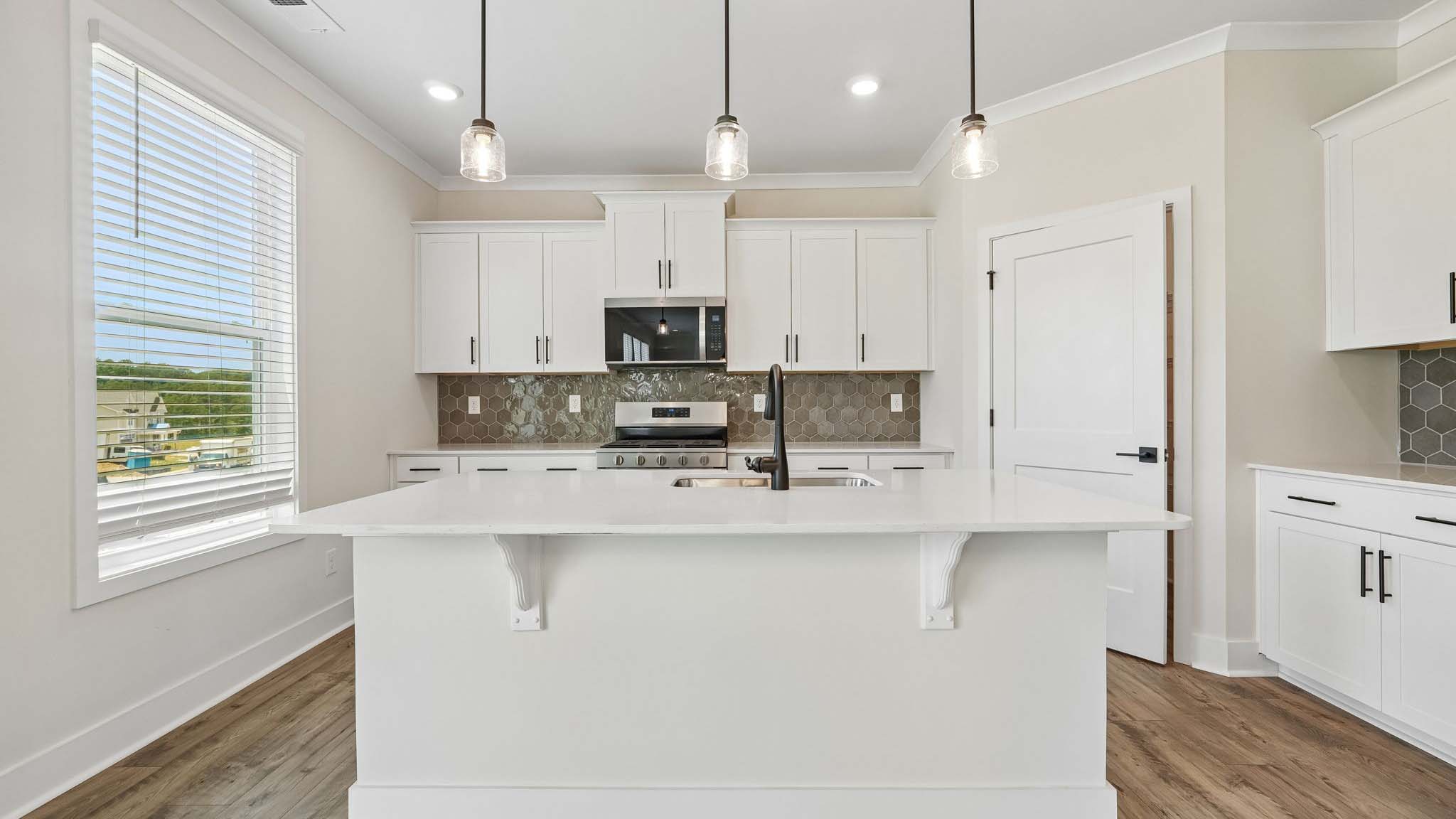 Kitchen and island with windows