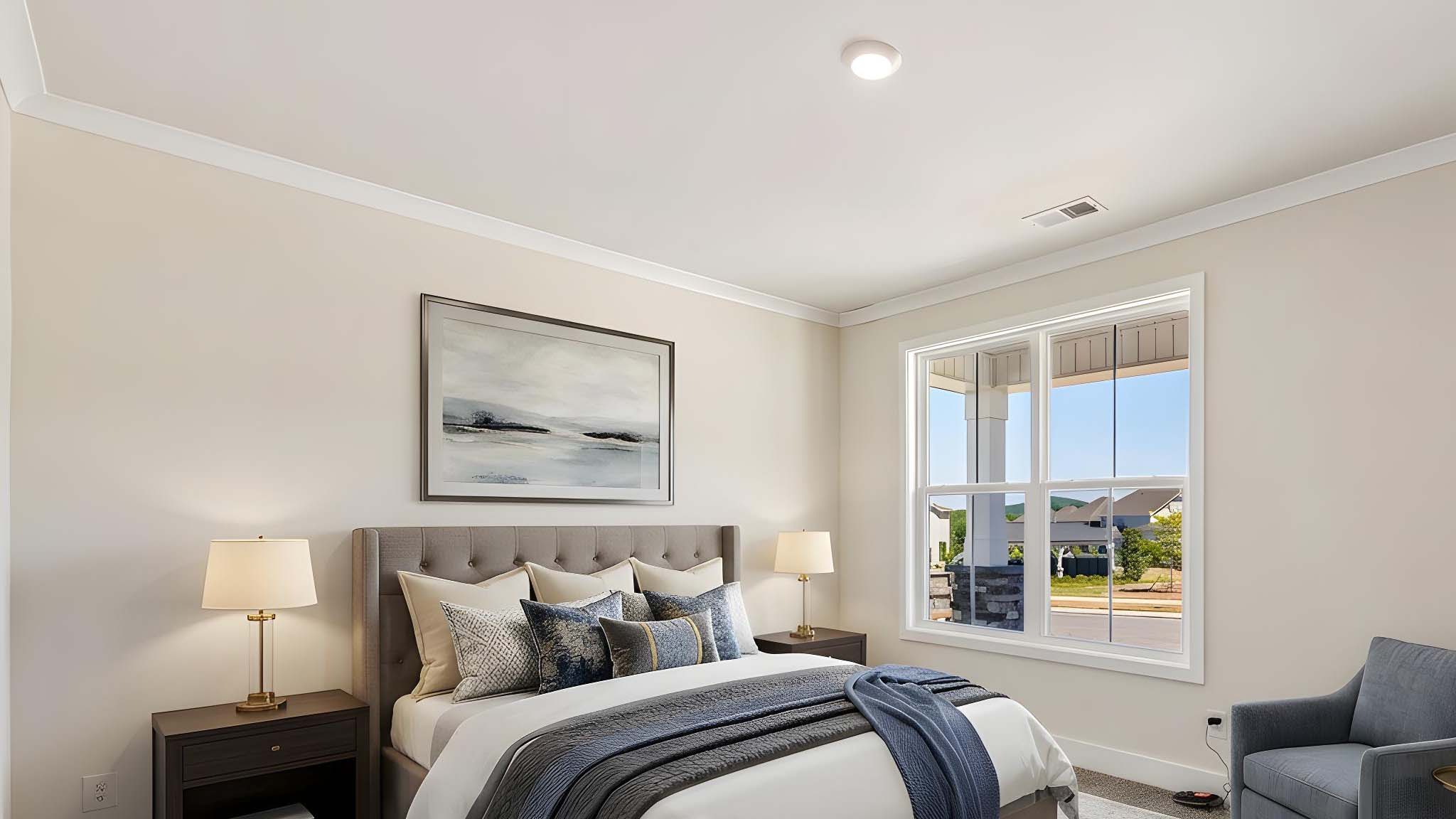 Carpeted bedroom with windows