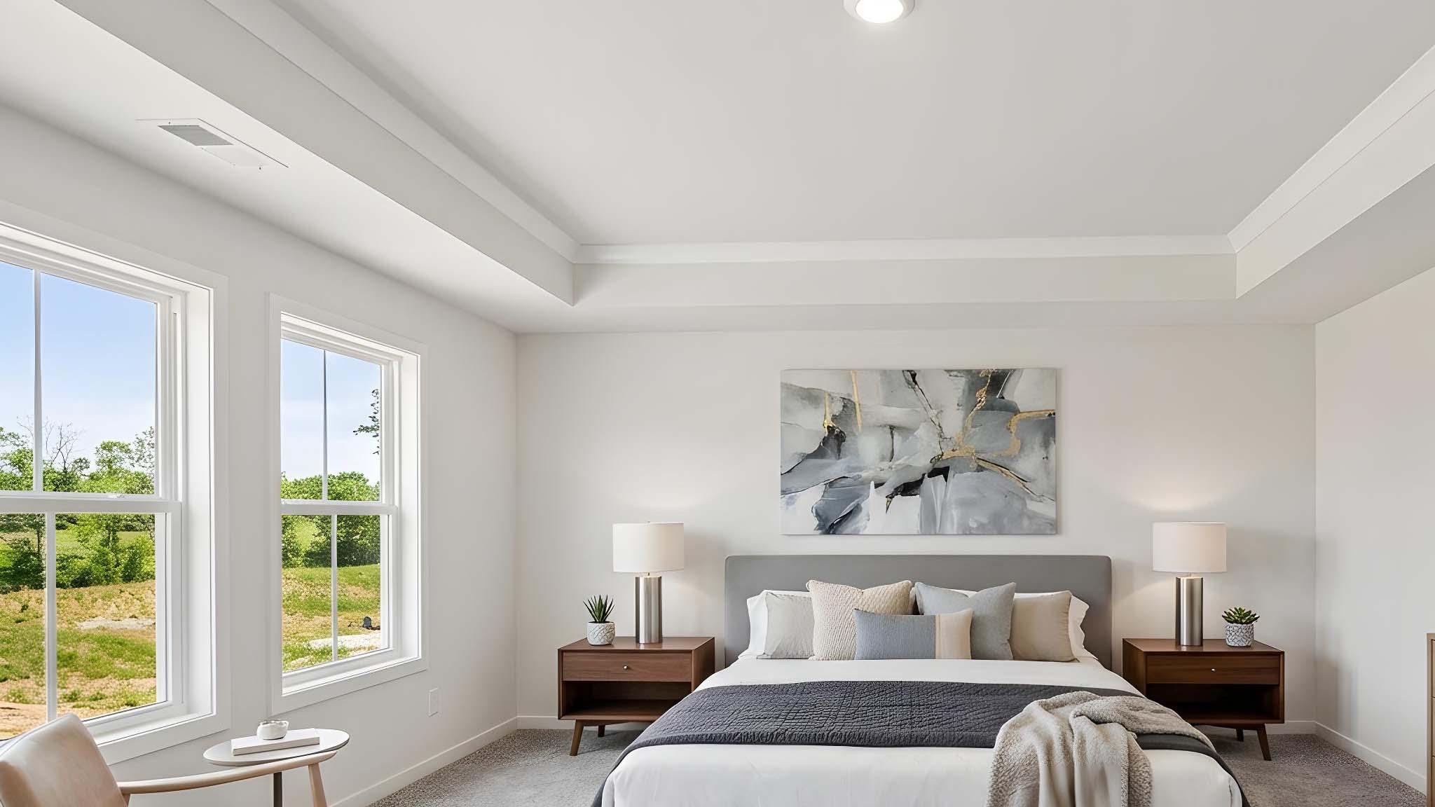 Primary carpeted bedroom with windows