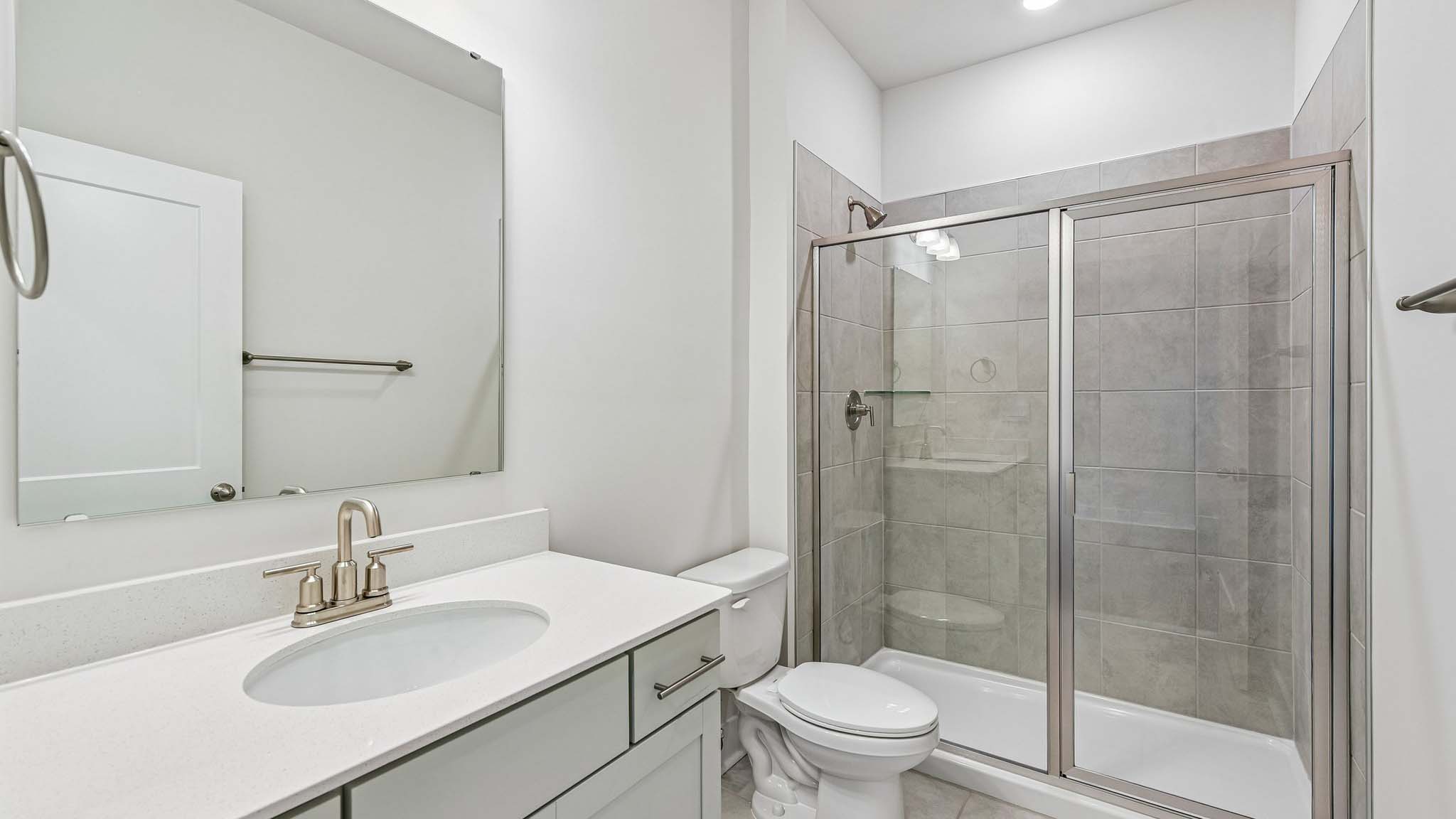 Bathroom with standing glass shower