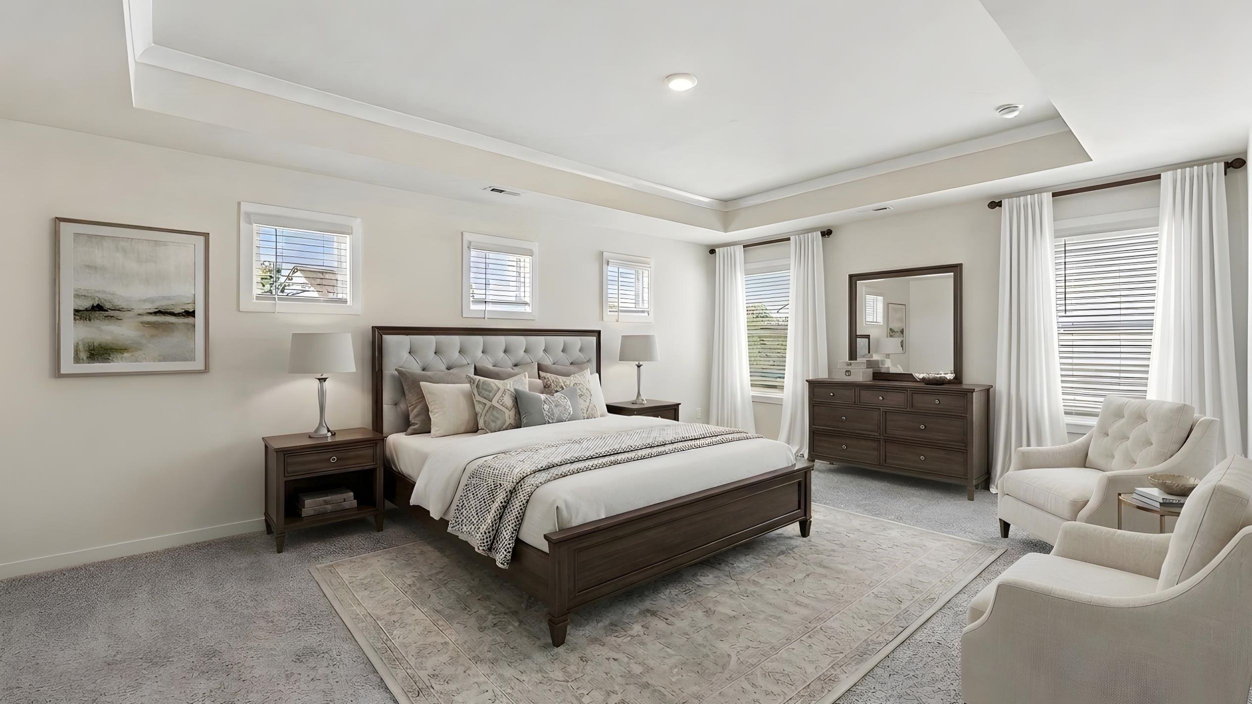 Primary carpeted bedroom with windows