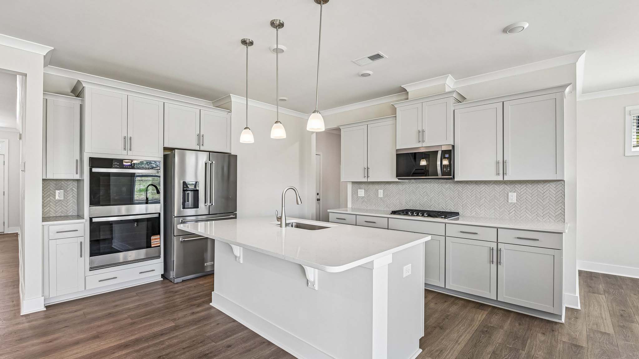 Kitchen and island with stainless steel appliances and lots of cabinet space