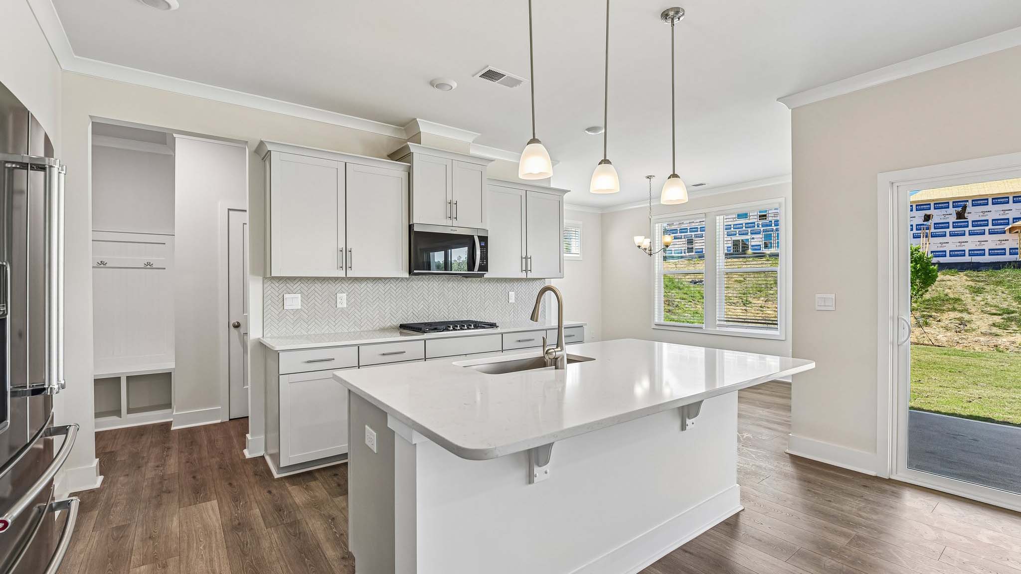 Kitchen and island with stainless steel appliances and lots of cabinet space
