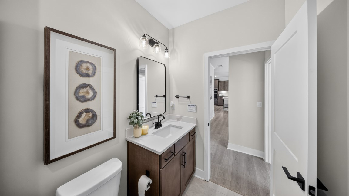 Bathroom with standing glass shower and sink