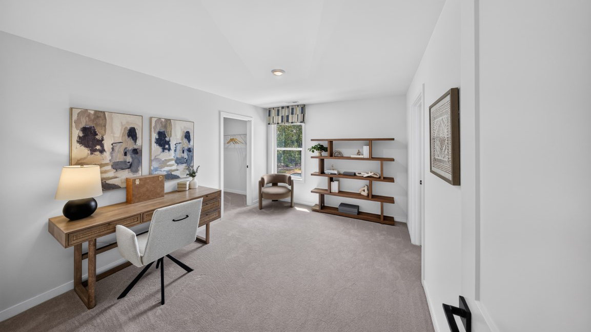 Carpeted bedroom/office staged