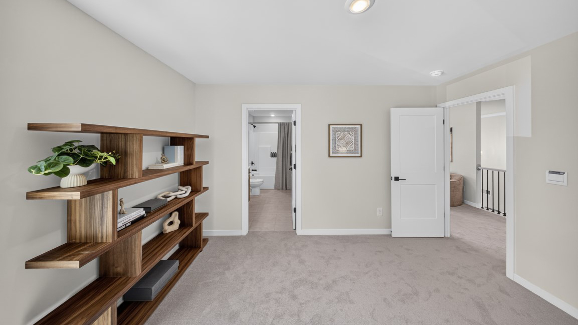 Carpeted bedroom/office staged
