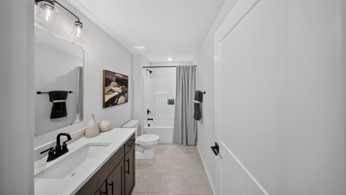 Bathroom with bathtub and shower combination
