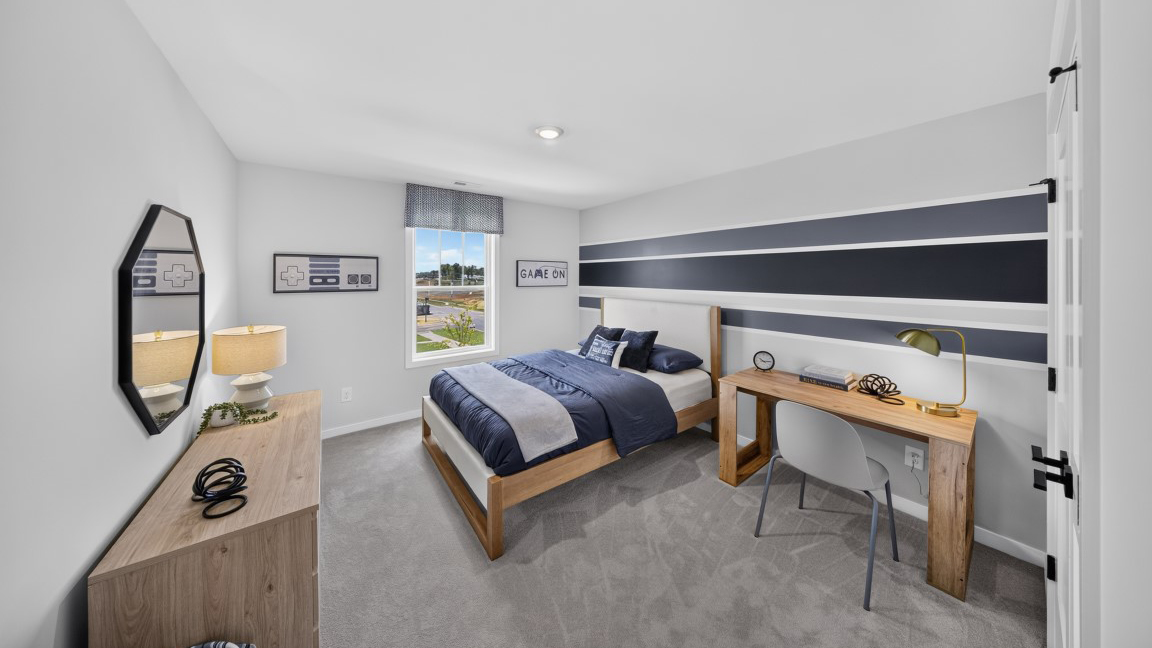 Carpeted bedroom with windows