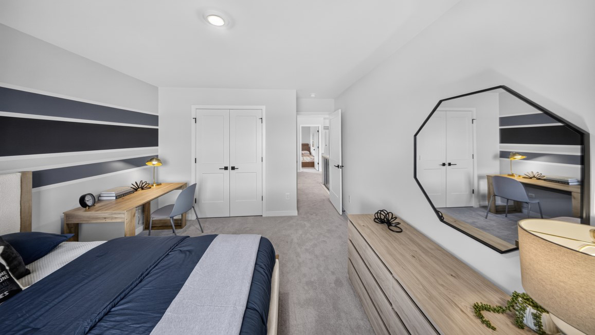 Carpeted bedroom with windows