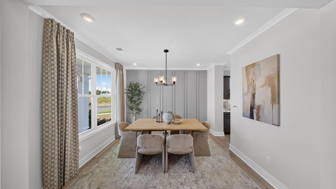 Dining area by the stairs with windows