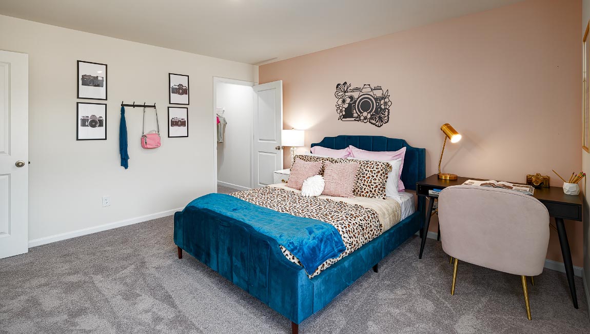 Carpeted bedroom with windows