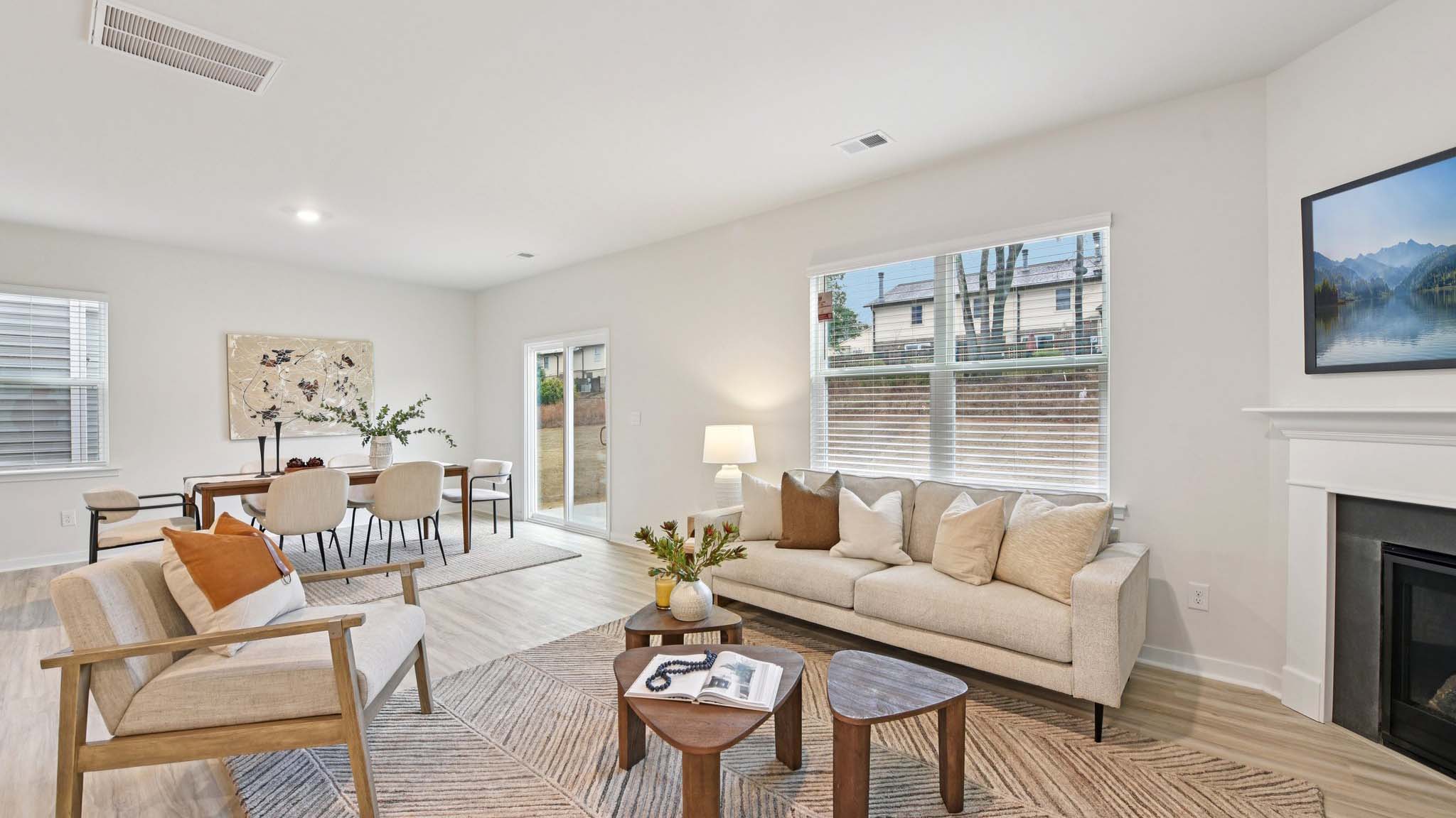Spacious family room with windows and fireplace