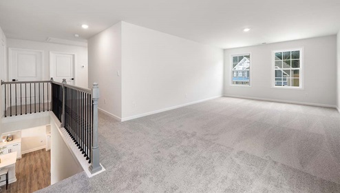 Carpeted bedroom with large window