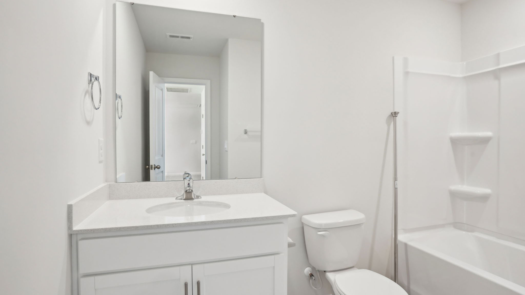 Bathroom with single sink and tub shower combination