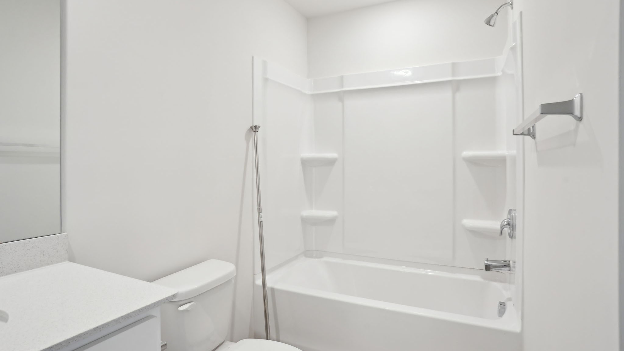 Bathroom with single sink and tub shower combination