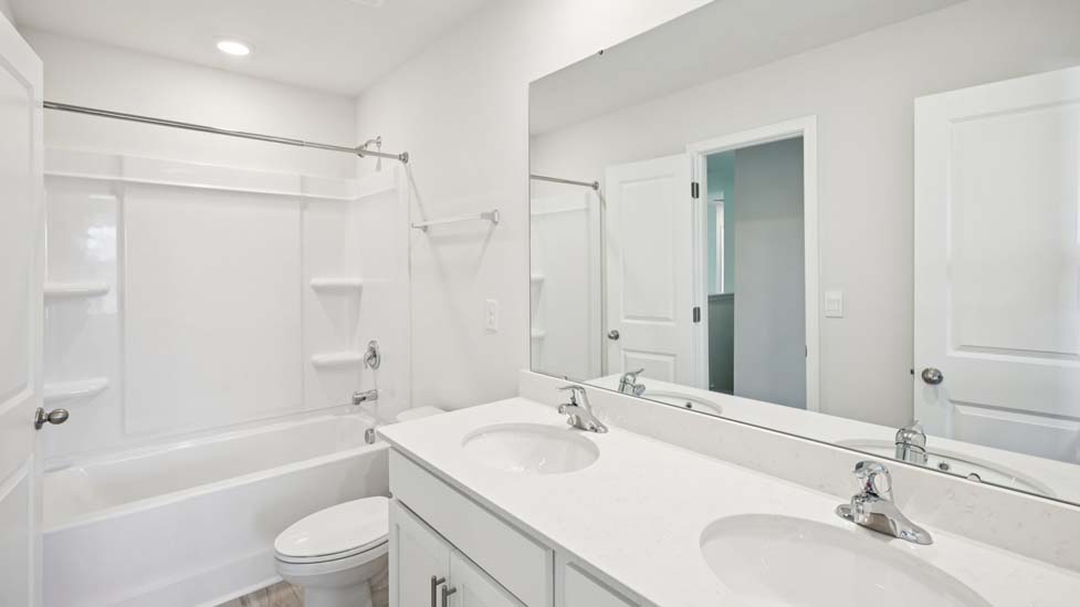 Bathroom with single sink and tub shower combination