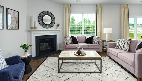 Open living room with large window, and fireplace