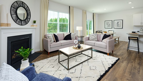 Open living room with large window, and fireplace