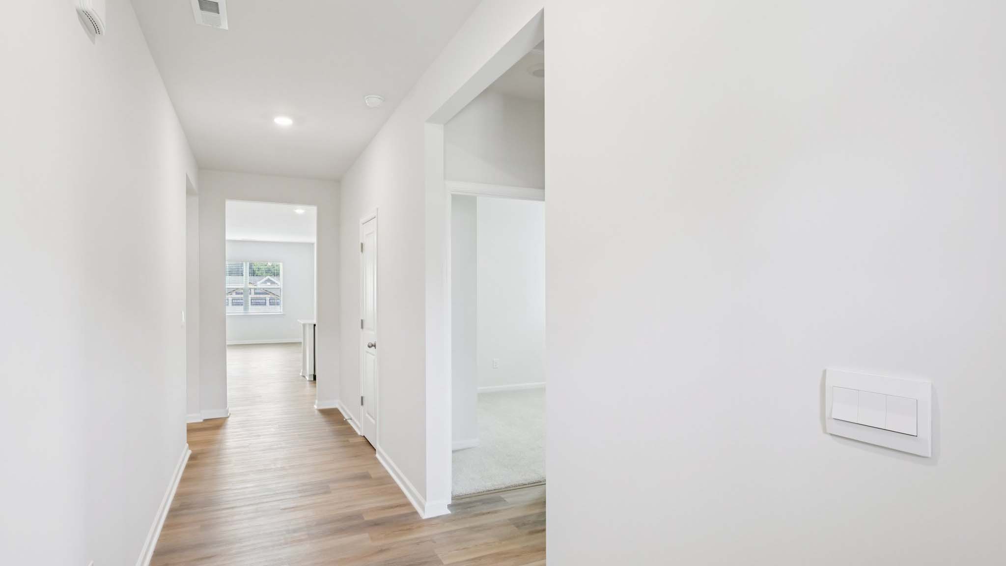 Welcoming foyer with wood floors