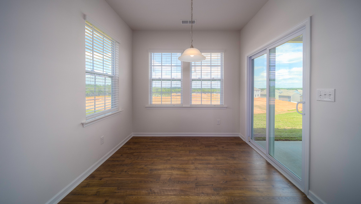 Breakfast area off kitchen with sliding glass back door