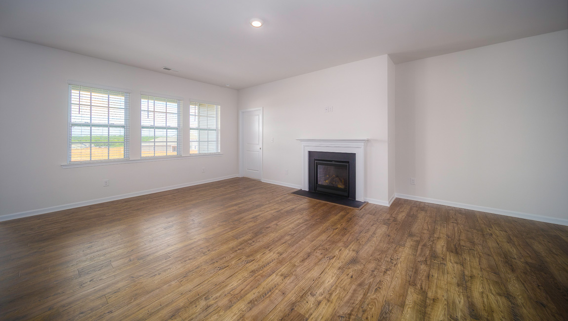 Family room with windows and fireplace