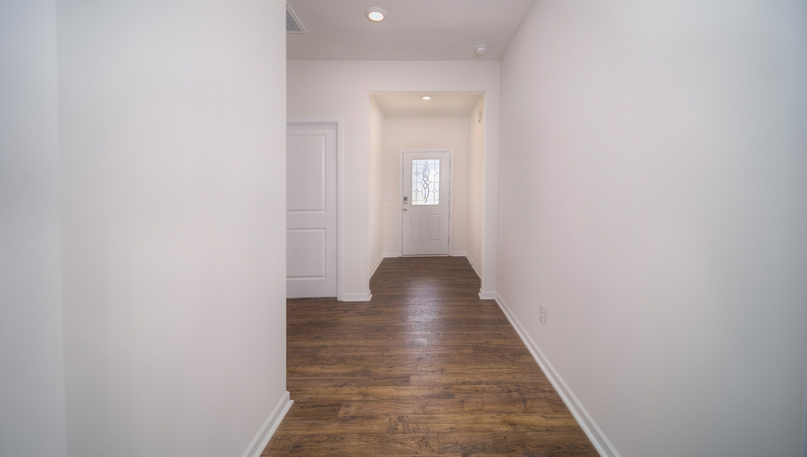 Welcoming foyer with view of hallway