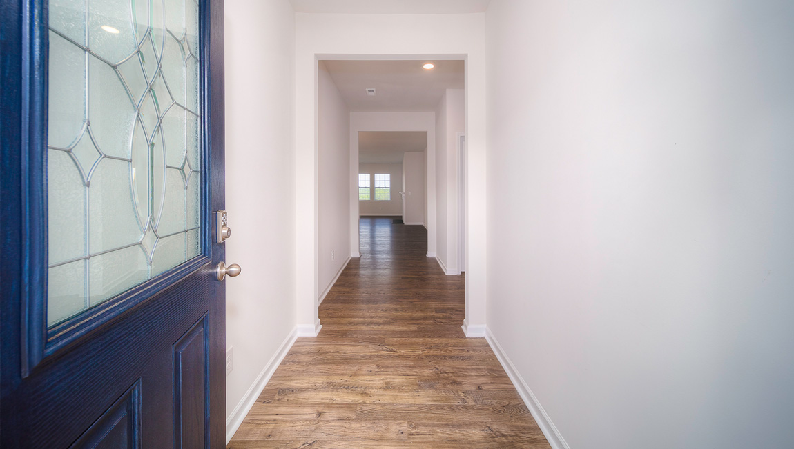 Welcoming foyer with view of hallway