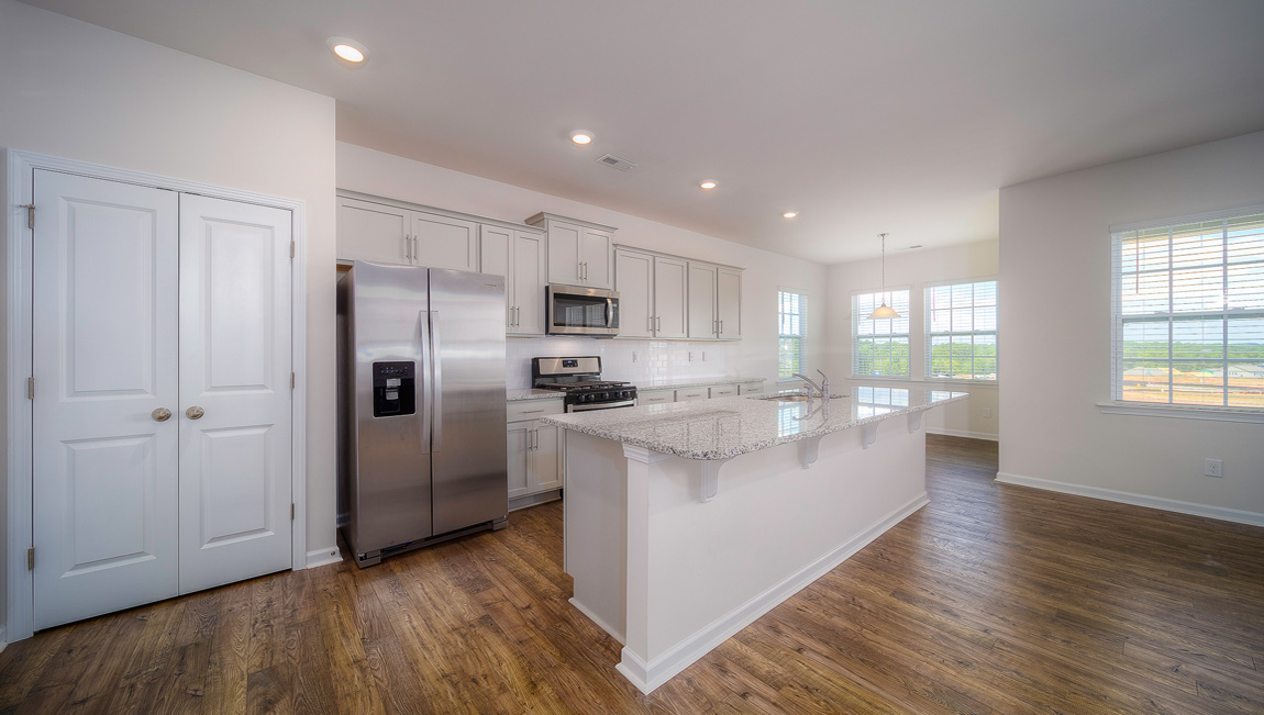 Large Kitchen and Island with stainless steel appliances