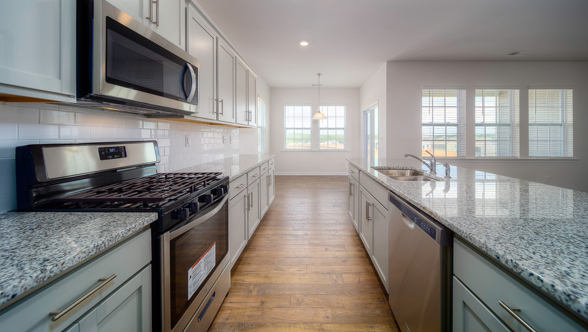 Large Kitchen and Island with stainless steel appliances