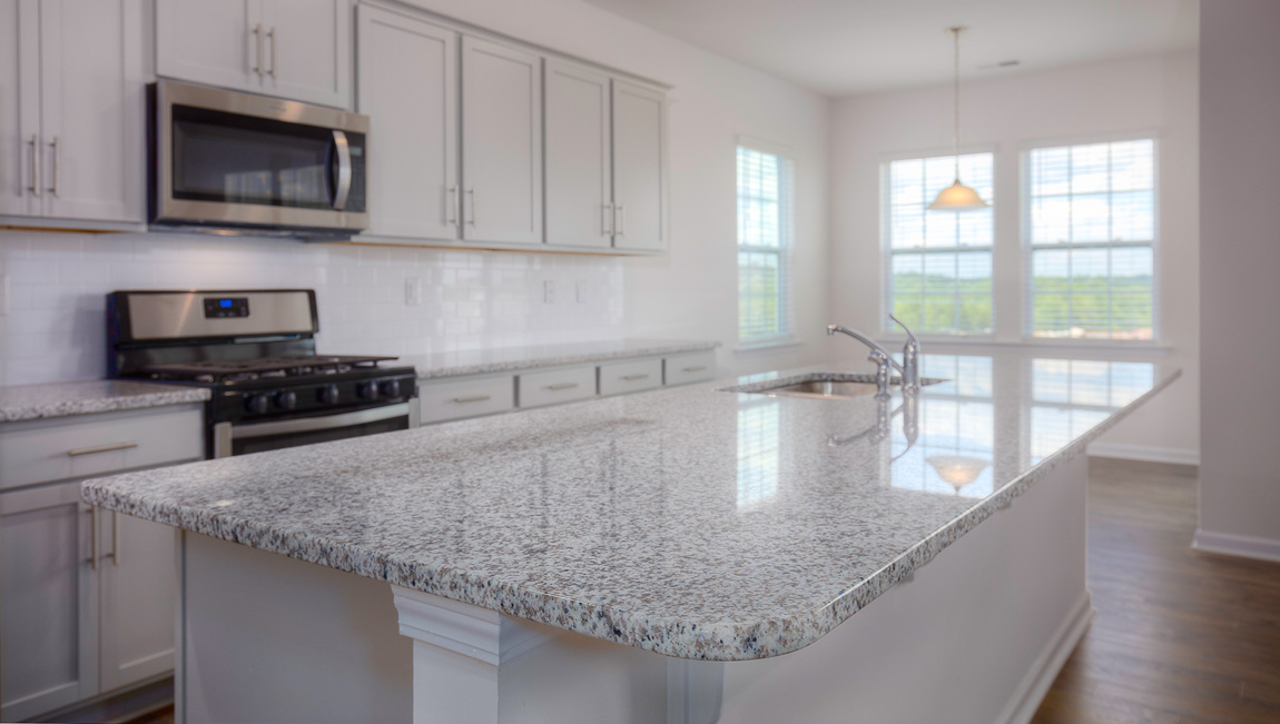 Large Kitchen and Island with stainless steel appliances