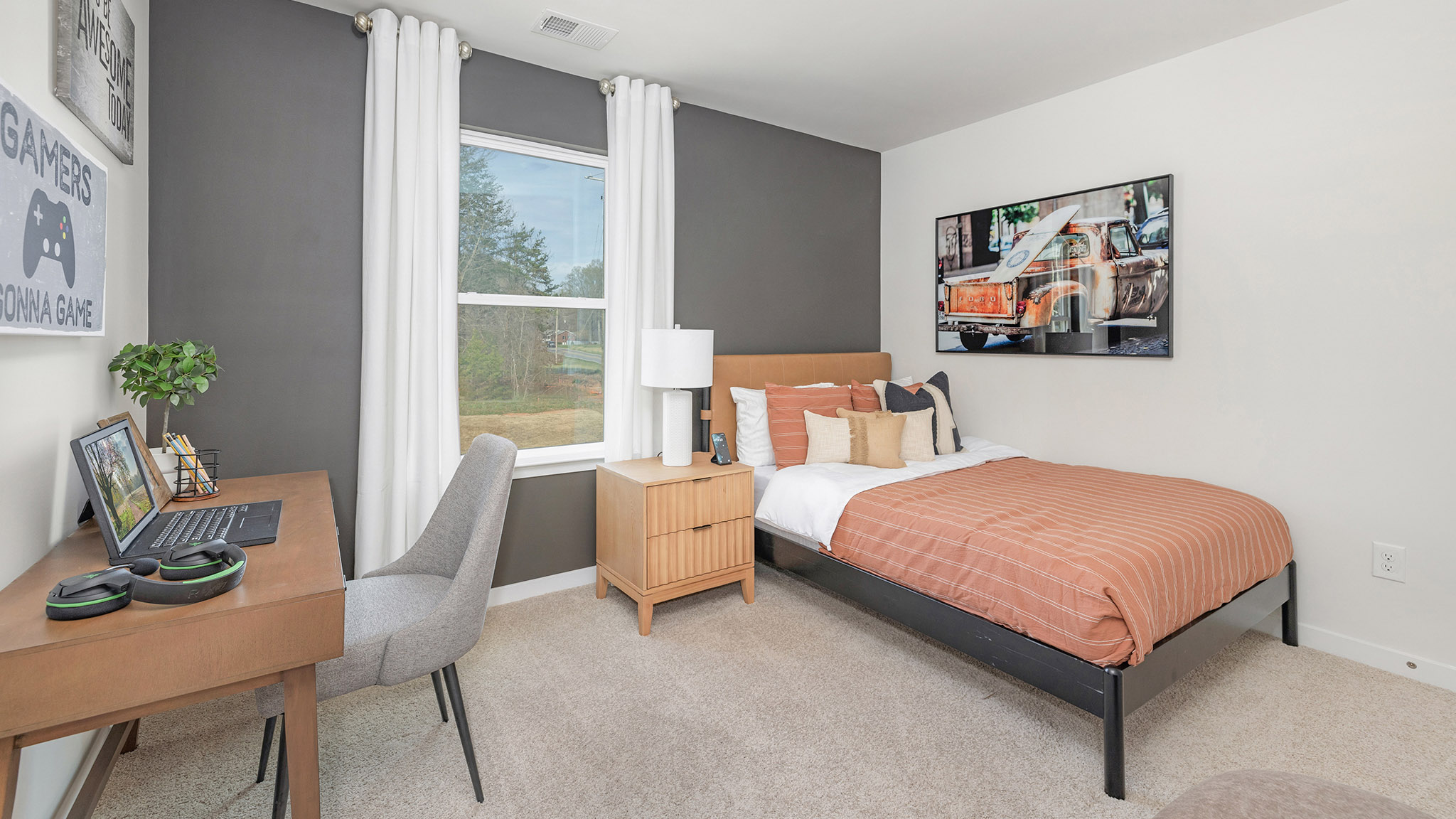 Carpeted bedroom with large windows